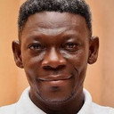 Kofi Adu als Mr. Owusu