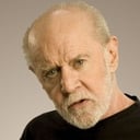 George Carlin als Hitchhiker