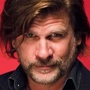 Tex Perkins als Raymond