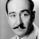 Adolphe Menjou als Deakon Maxwell