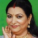 Abha Parmar als Mrs. Gupta (Minister's Wife)