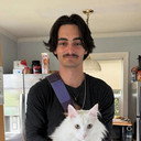 Layne Jacobson als Layne, Gay Times Reporter