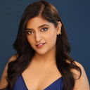 Kiran Madahar als Host