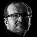 Arko Okk als Man With a White Hat in the Cyclecar Driven by Juris Pakalninsh