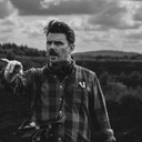 Paudie Baggott als News Reporter (as Paudie Baggott)