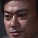 Isao Tamagawa als Captain Okitsu