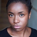 Nneka Okoye als K-Lash