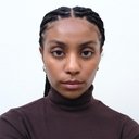 Kiah Butts als Kiah - Executive Secretary