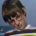 John Brewer als The Brat