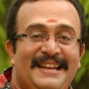 Saikumar als Madhavan Menon