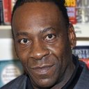 Booker Huffman, Jr. als Booker T (SmackDown G.M.)