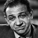 Sid James als Benny