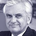 Kenneth Kendall als BBC-12 Announcer (uncredited)