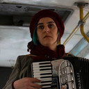 Neda Asef als the musician