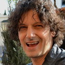 Enrico Vecchi als Grocer