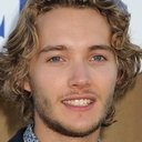 Toby Regbo als John