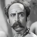 K. P. Kamakshi als Poosaari