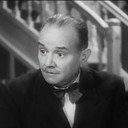 André Brunot als le curé