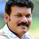 Vinod Kedamangalam als Temple Committee Member