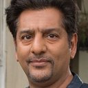 Nitin Ganatra als August Swain