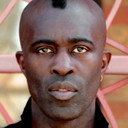 Sola Akingbola als Self - Percussion, backing vocals