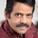 Balachandra Menon als CM Madhavan