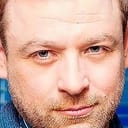 Andrii Zhurba als Camp Commandant Savin