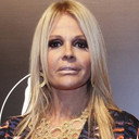 Monique Evans als funcionária de Maria Helena