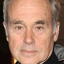 John Dunsworth als Voice of Urban (voice)