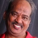 Krishnamoorthy als Muthu