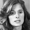 Thaís de Andrade als Secretary
