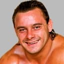 Tom Billington als The Dynamite Kid