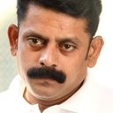 Saravana Subbiah als Collector of Arumapuri District