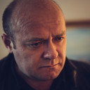 David Walker als Reverend MacDonald