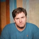 Tim Dillon als Arkham Guard