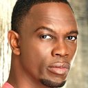 Newton Mayenge als Car Driver (uncredited)