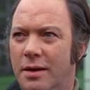 John Stratton als Roger Nowell