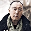 Ni Dahong als Mr. Wang