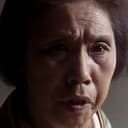 Kanae Kobayashi als Bereaved Woman's Servant