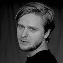 Toms Veličko als Mikus