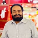 Bob Khaira als Flour Mill Shopkeeper