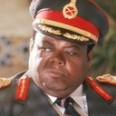 Prince Hughes als Idi Amin