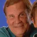 John Travis als Self (voice) (as Jim Hodges)