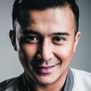 Aaron Aziz als President