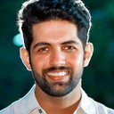 Dev als Ajay Rudhran