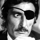 Gilberto Galimberti als Poker player with eye patch