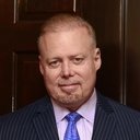 Rick Collins als Apocalypse Inc. Chairman