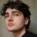 Andrew Malik als Eman
