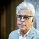 Béla Ernyei als John