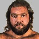 John Minton als Big John Studd (Referee)